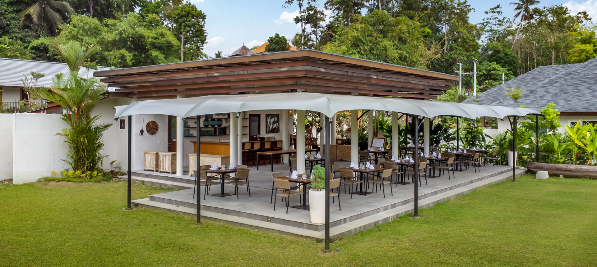 Family-friendly open-air seating at Hura Restaurant